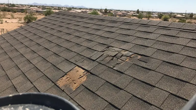 Roof with missing and cracked shingles